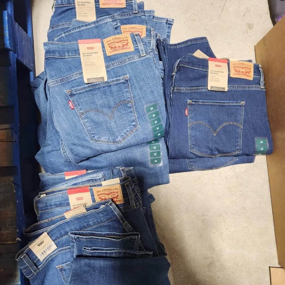 50 Pieces of brand new name brand clothing ! We will mix it up for you.
